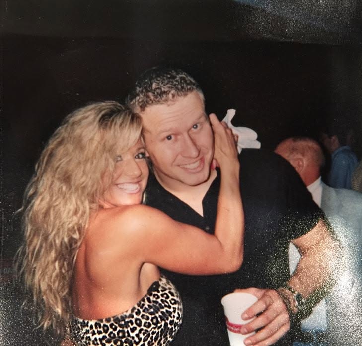An early photograph of Candi with her arms around Greg, from when they met